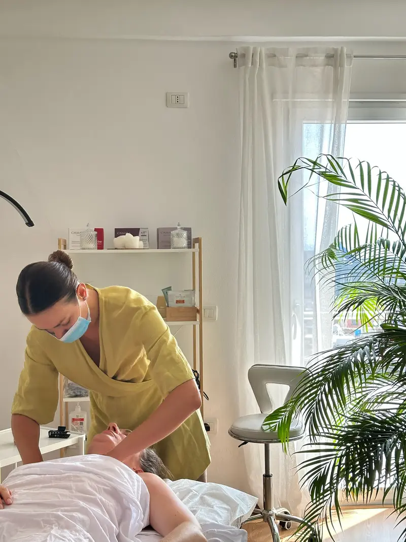 Neck and décolleté work during a facial massage in the Sundara Studio room